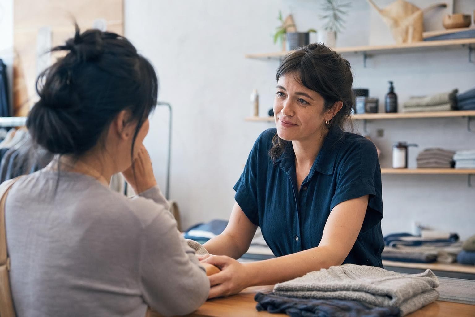 A photo of a business owner sincerely making things right for a customer in an empathetic, face-to-face moment.