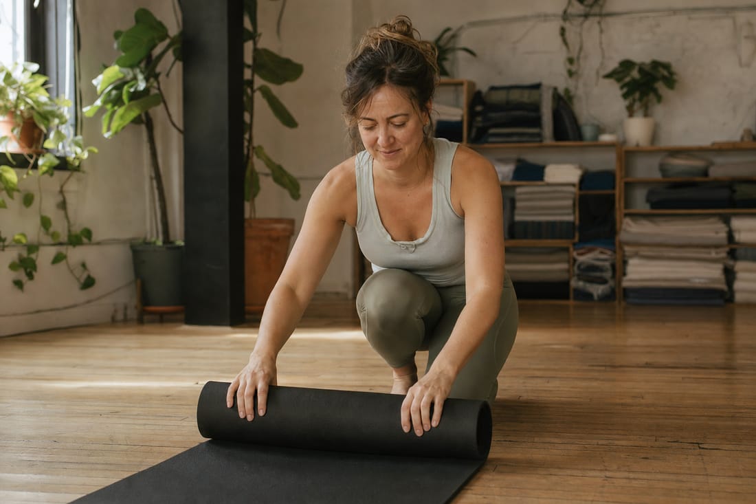 A yoga-studio owner setting up before class