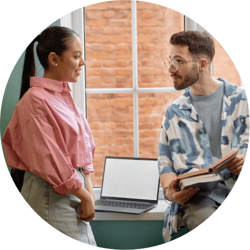 Two colleagues reviewing a printed report together