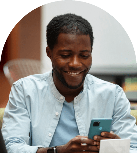 Founder smiling during a phone call