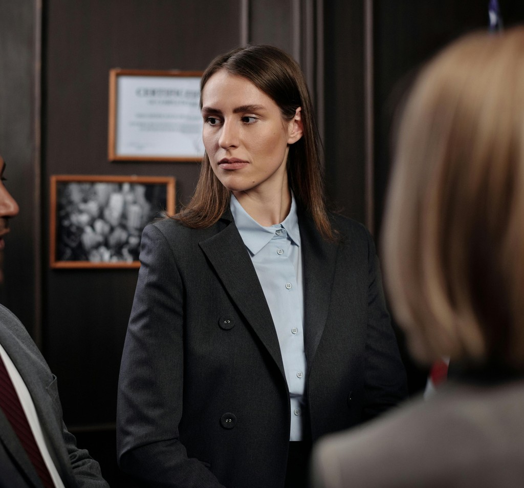 Attorney standing in a wood-panelled office