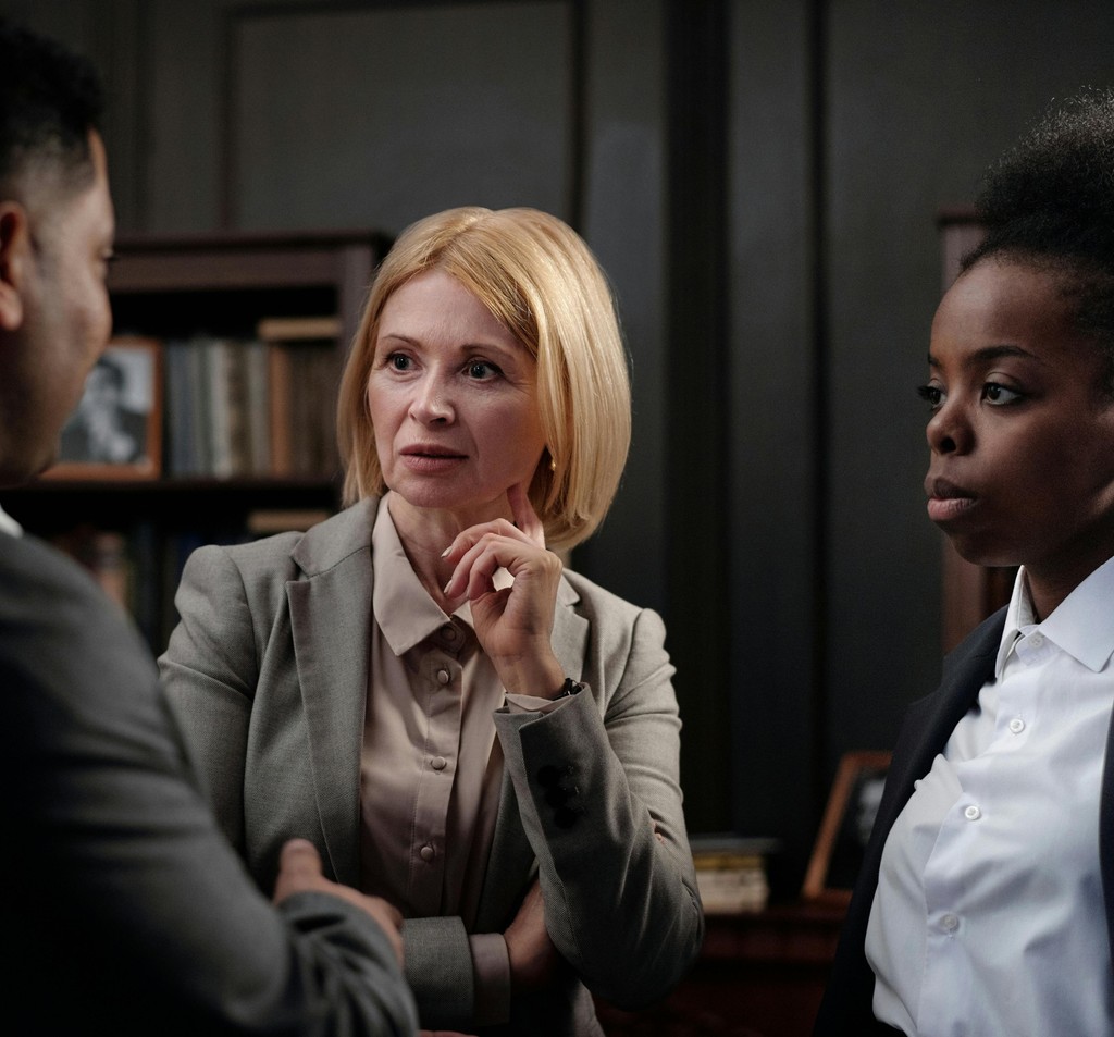 Attorneys in conversation in a meeting room