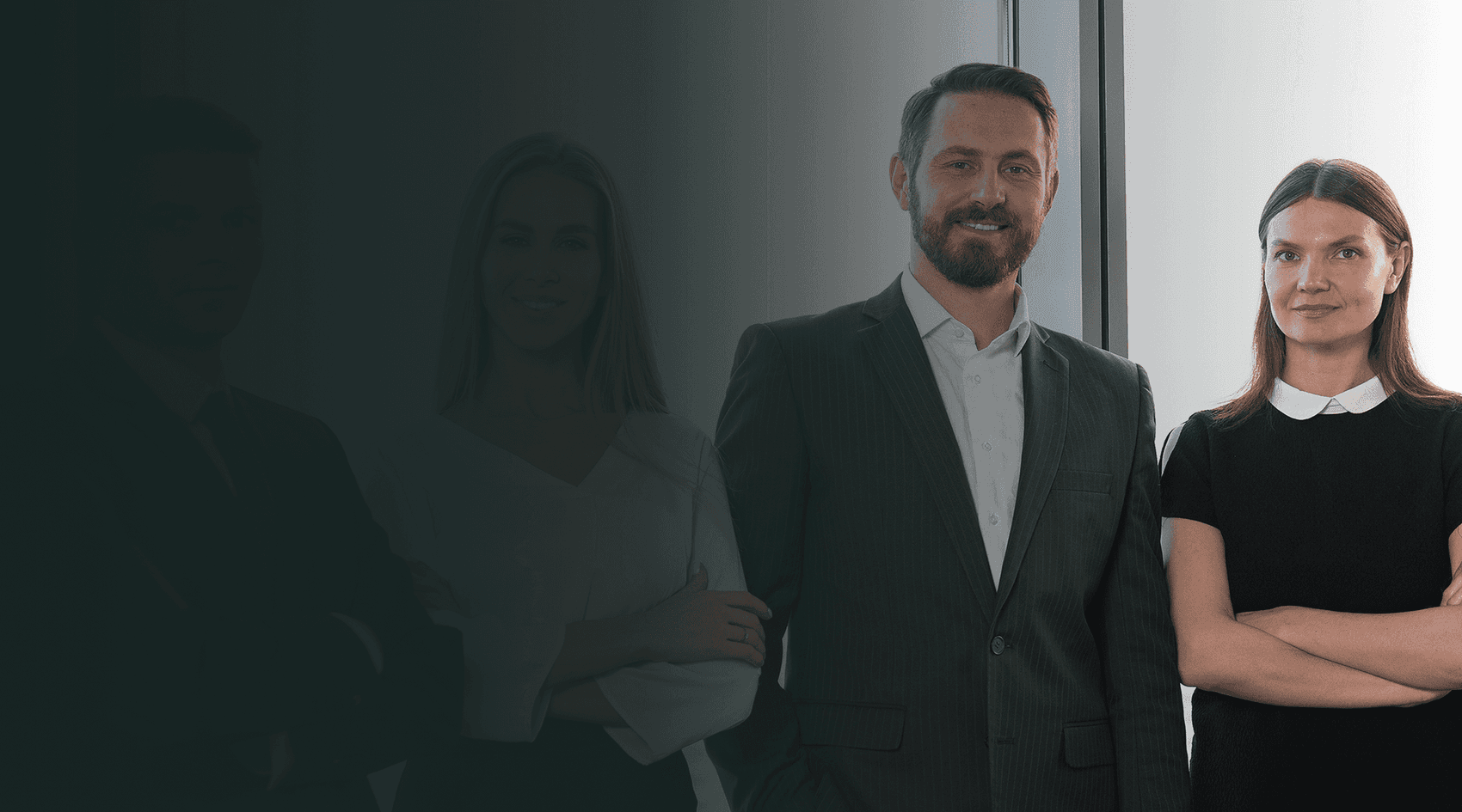 Two confident attorneys standing in a sunlit modern office